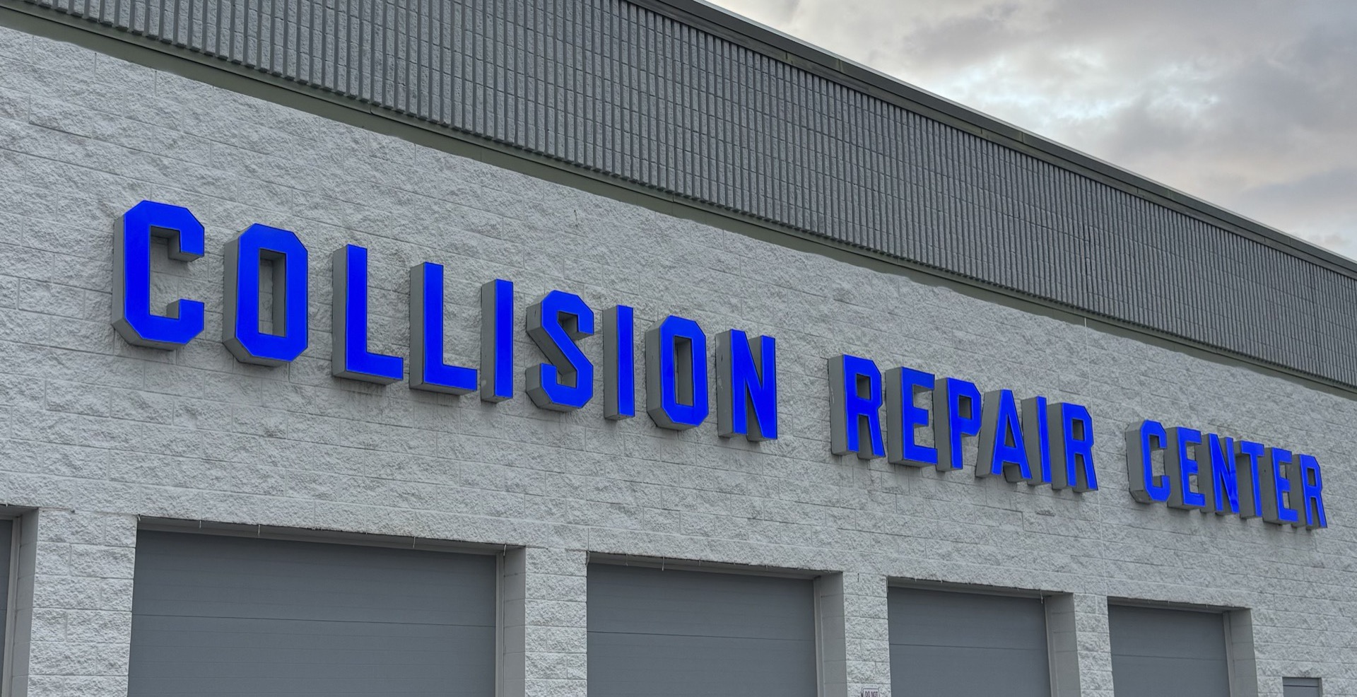 Updated Bob Rohrman Collision Repair Center exterior signage after the 2026 brand refresh at 3400 National Drive