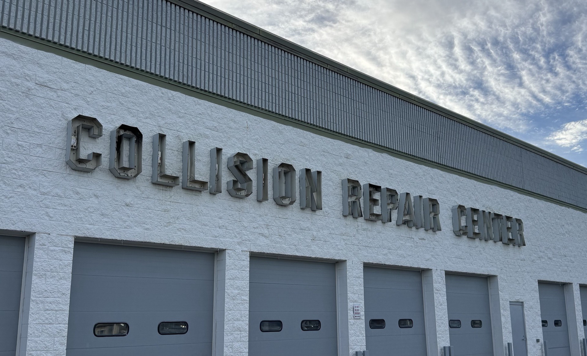 Bob Rohrman Collision Repair Center sign installation in progress during the spring 2026 brand refresh